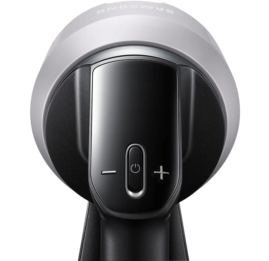 Tête d'aspirateur avec commandes. Design noir et argent avec boutons d'alimentation visibles.