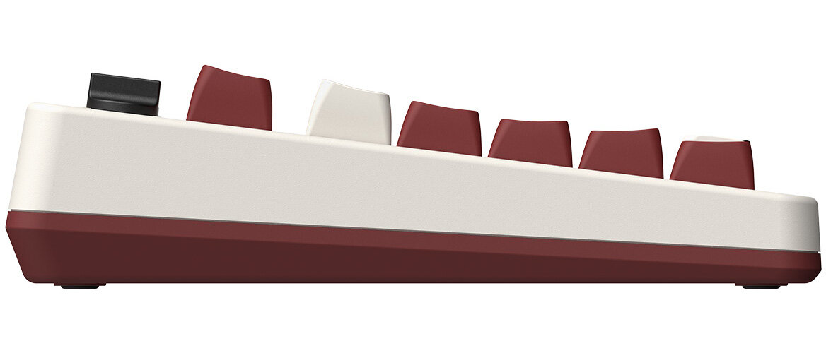 Widok z boku klawiatury retro. Bordowe klawisze, biała rama. Niektóre klawisze są białe.