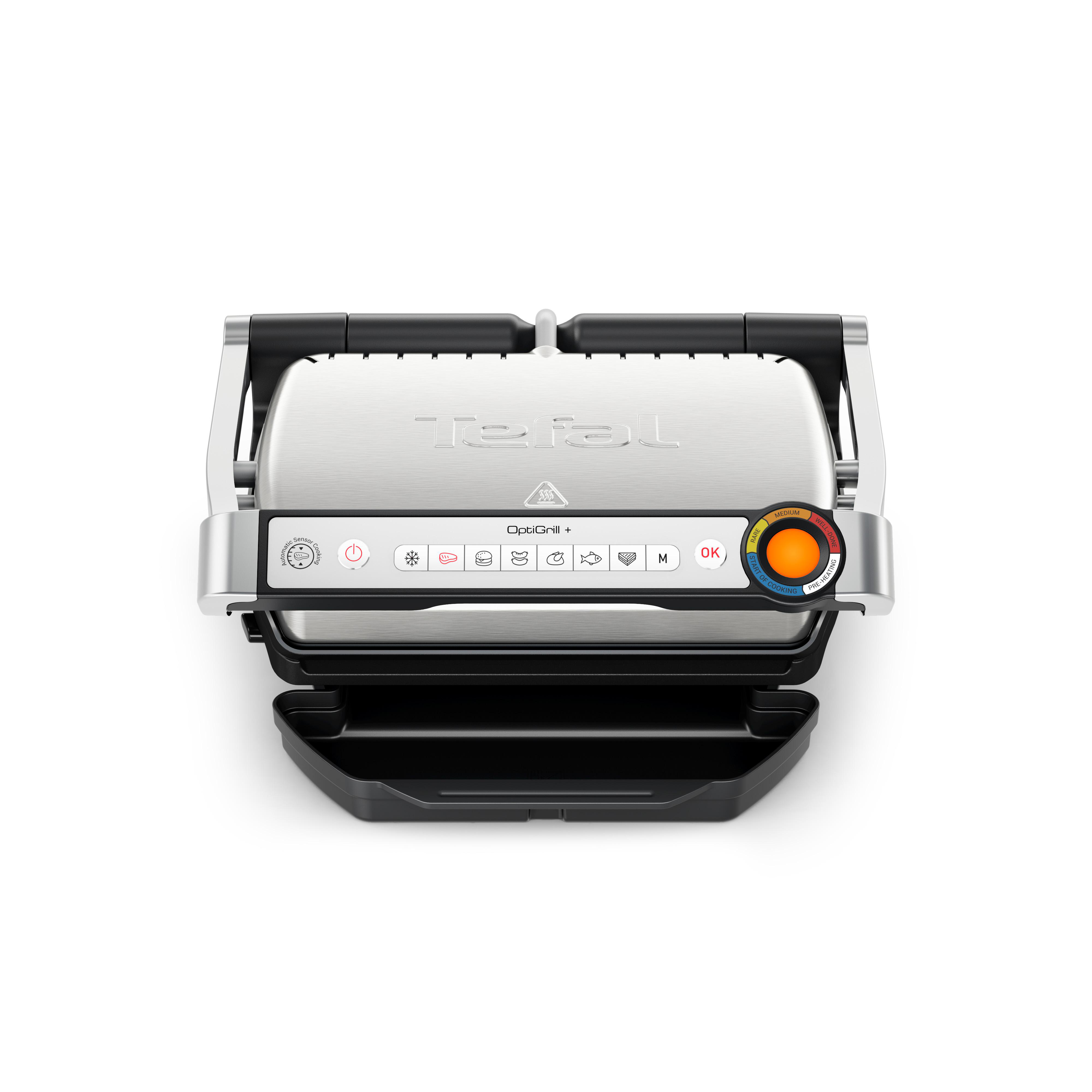 Ein Tefal OptiGrill+ mit offenem Deckel. Es hat eine silberne Oberfläche und ein Bedienfeld mit Knöpfen und einem Drehregler.