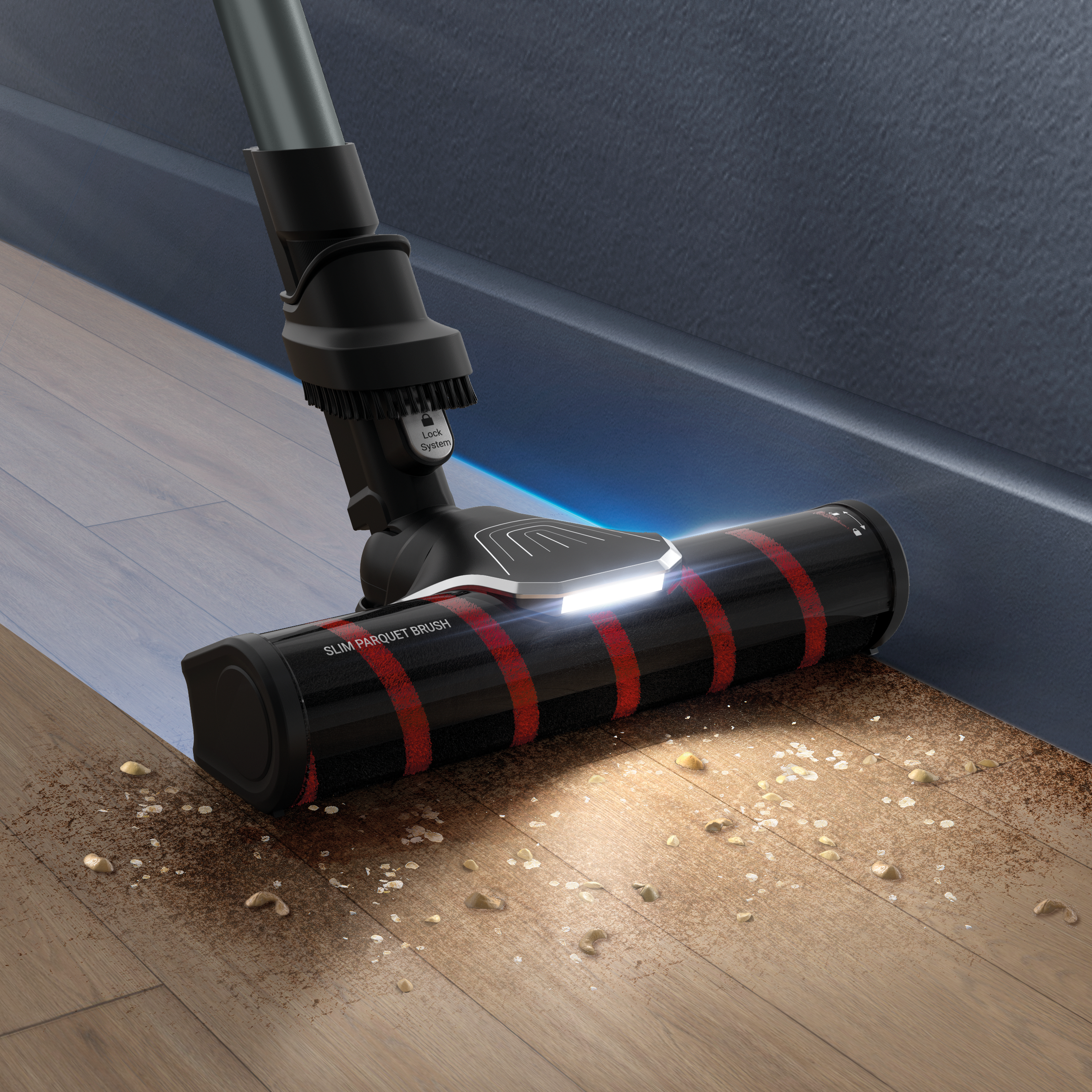 Zbliżenie głowicy odkurzacza czyszczącej drewnianą podłogę. Widoczne czerwone paski, brud na podłodze.