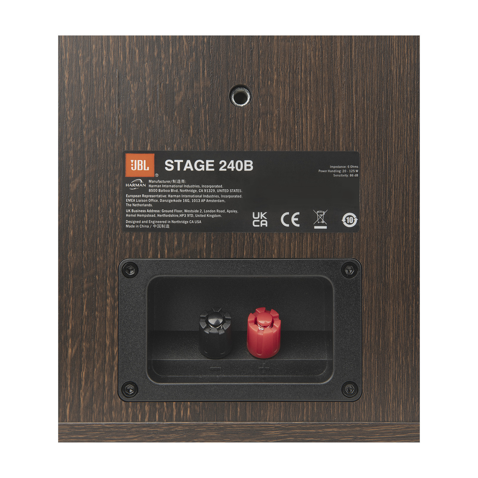 Hoparlör arkası. Kahverengi ahşap damarı. Siyah ve kırmızı konektörler. JBL Stage 240B etiketi. Metin detayları ve logolar.
