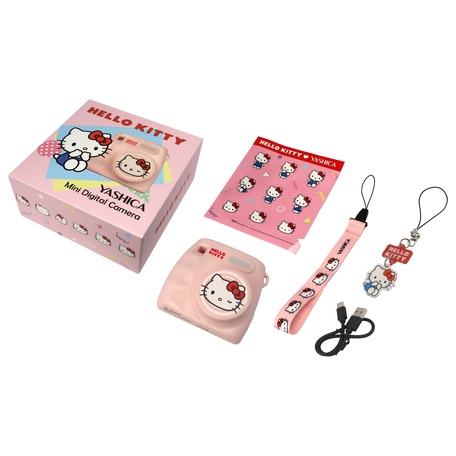 Hello Kitty camera set: camera, box, strap, USB cable, and charms. Pink, white, and black.