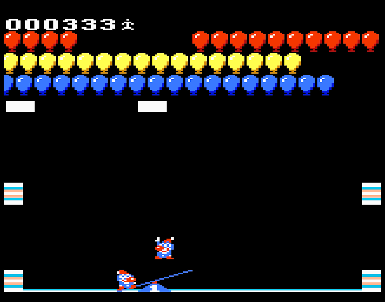 Jeu d'arcade : Personnage sur bascule vise à éclater des ballons. Ballons en haut. Fond noir.