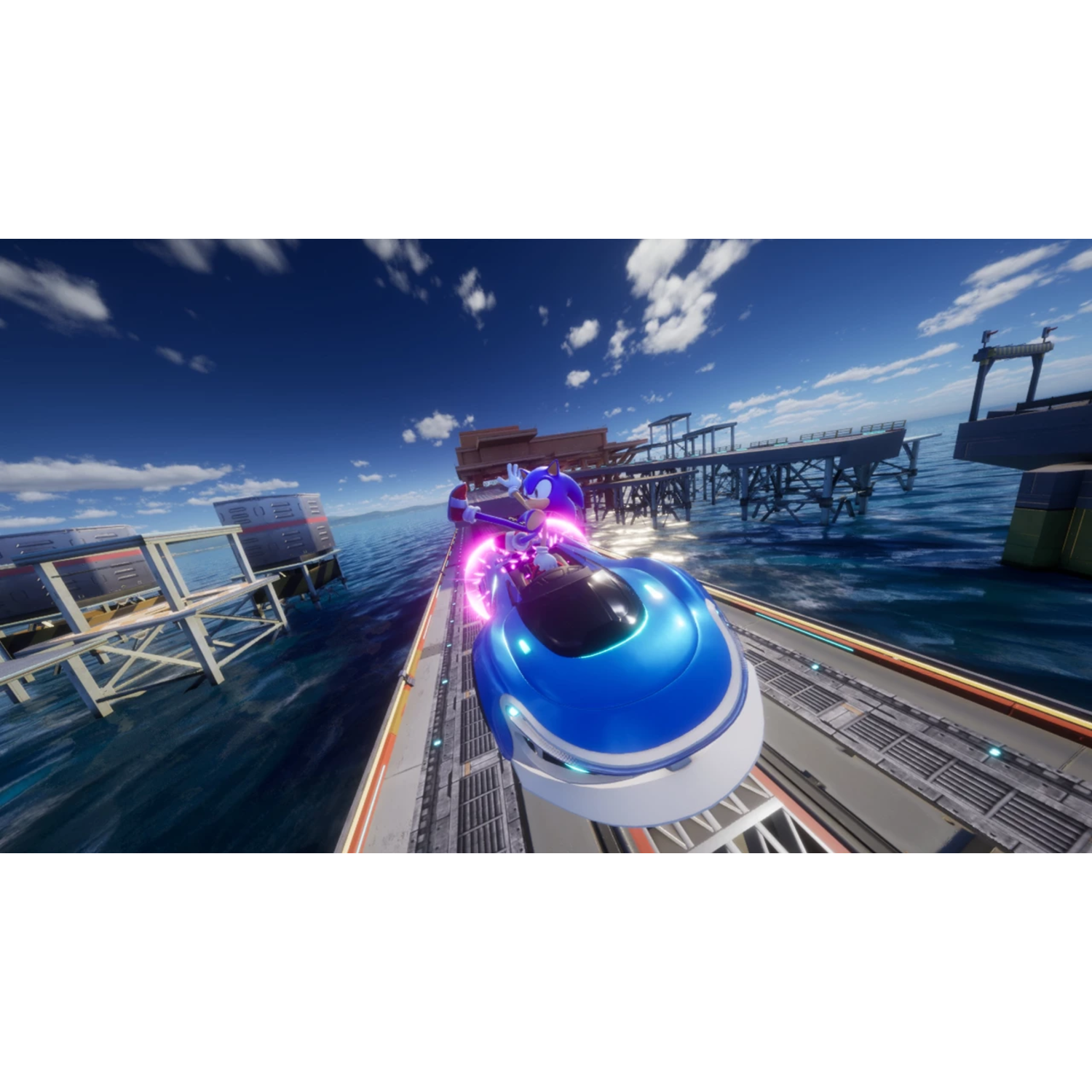Sonic in a blue car racing on a track over water with a bridge and blue sky background.