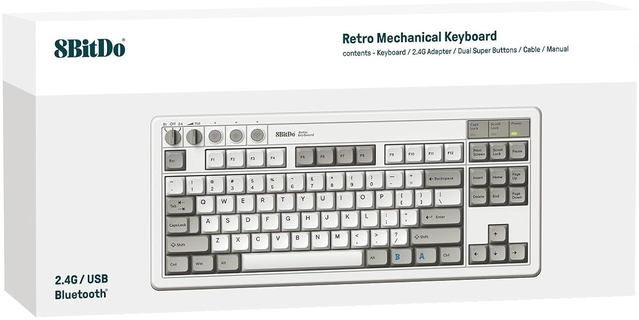 Klawiatura w pudełku, biała z szarymi klawiszami, design retro. Na pudełku napis 'Retro Mechanical Keyboard'.