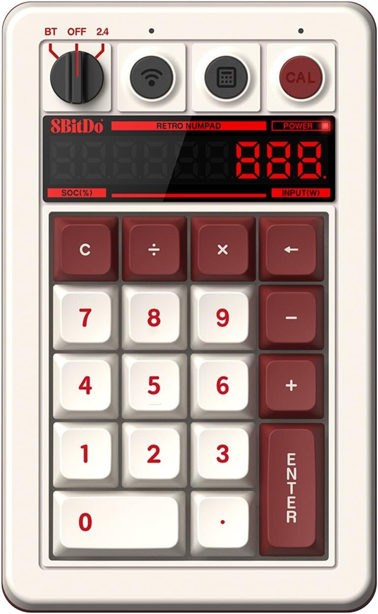Klawiatura numeryczna retro z beżowymi i bordowymi klawiszami. Posiada wyświetlacz i przełącznik.