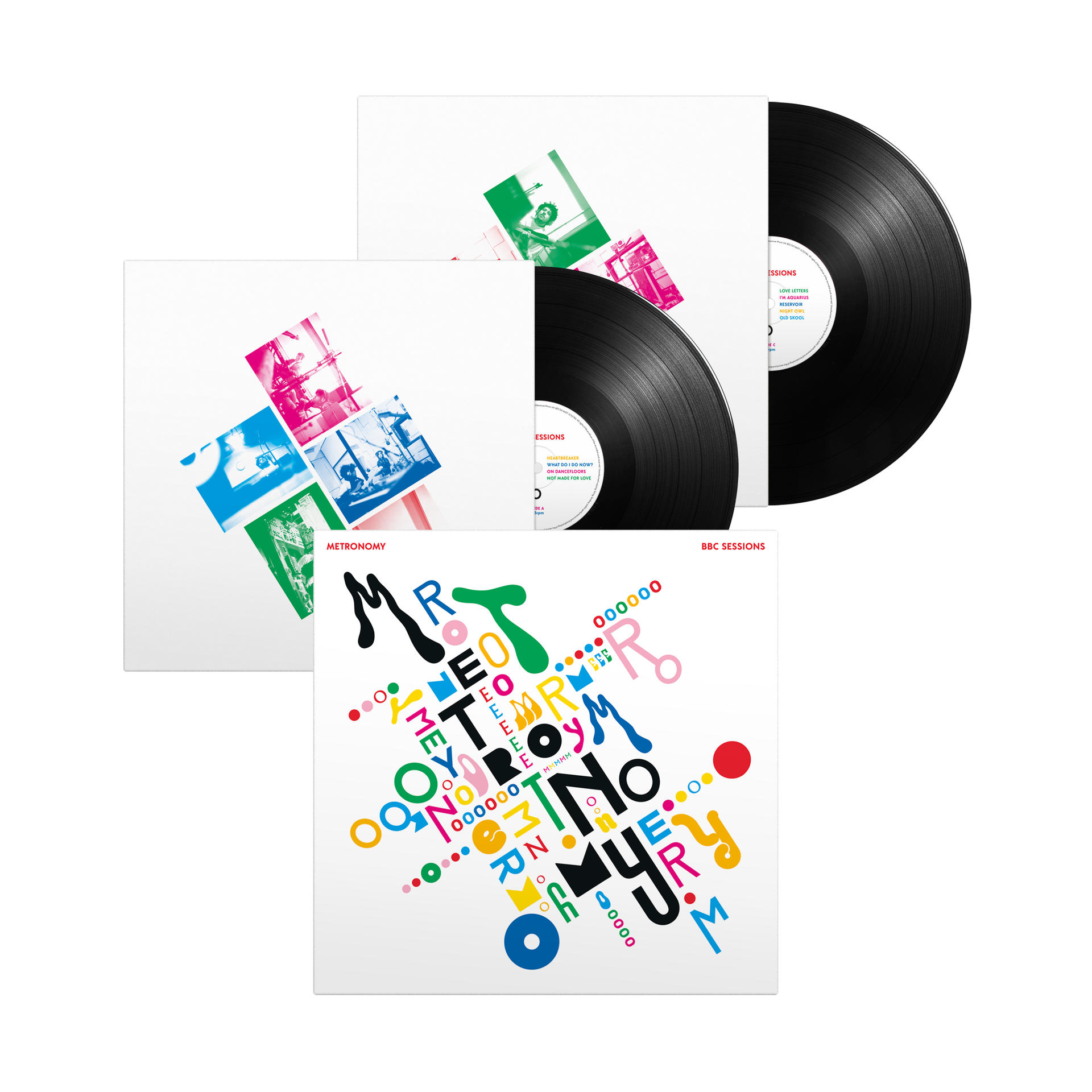 Albumcover von 'Metronomy' mit Schallplatten. Das Cover hat bunten Text auf weißem Hintergrund.