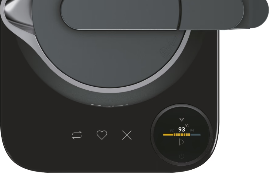 Bollitore nero con coperchio grigio scuro e display digitale che mostra la temperatura.
