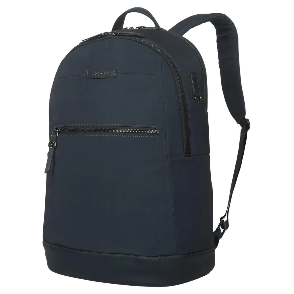 Mochila azul marino con cremalleras y correas negras. Un pequeño bolsillo en la parte delantera. La marca es Ogio.