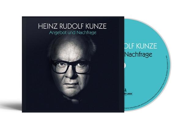 Albumcover mit einem Mann mit Brille, neben einer türkisblauen CD.