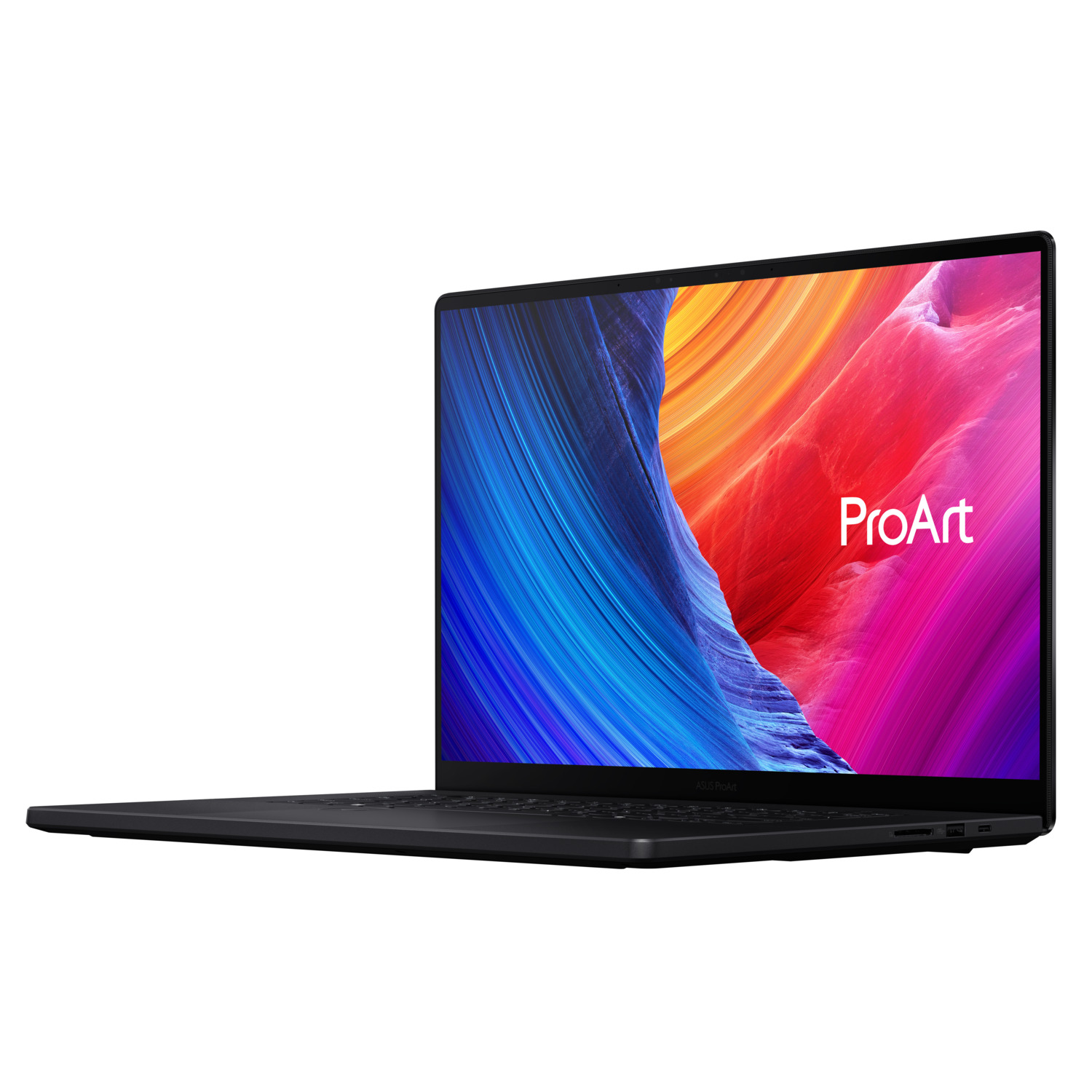 Ordinateur portable ASUS ProArt noir incliné sur fond blanc. L'écran affiche un dégradé coloré avec le logo ProArt.