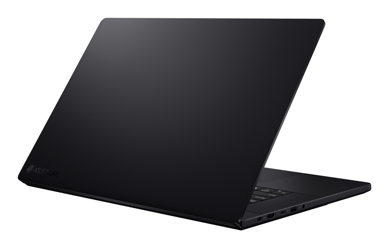 Portátil negro ASUS ProArt, abierto en ángulo. Acabado mate oscuro. Teclado visible. Fondo blanco.