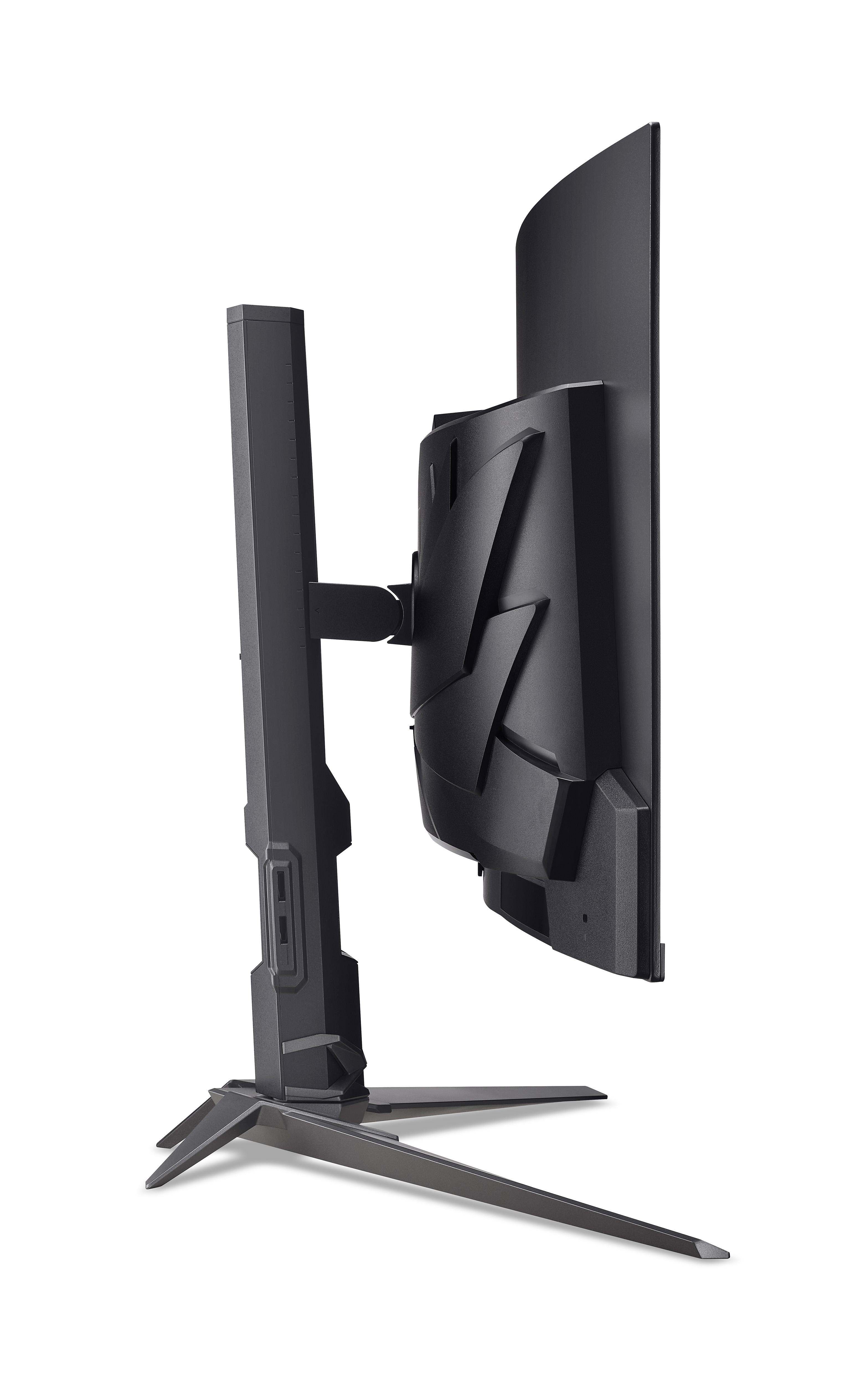 Ein schwarzer Gaming-Monitor ist im Profil zu sehen. Ständer und Rückseite sind vor weißem Hintergrund sichtbar.