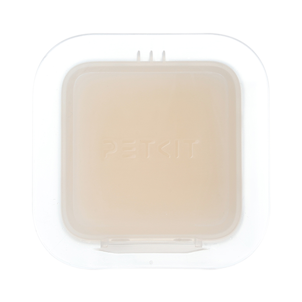 Beyaz kare Petkit kabı. İç kısım, Petkit logosu ile bej renktedir. Üstte küçük sekmeler bulunur.