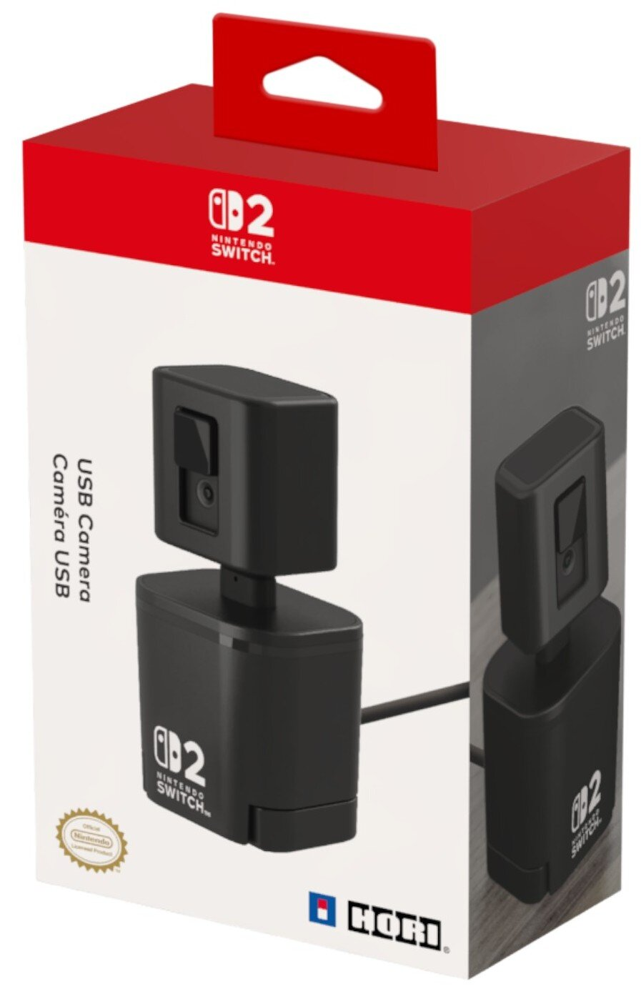 Pudełko z czarną kamerą USB. Czerwona góra z uchwytem, biały korpus z logo Nintendo Switch i nazwą produktu. Widoczna jest druga kamera.