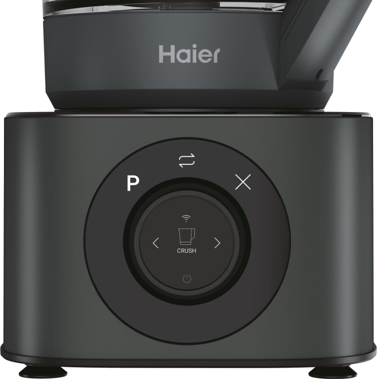 Un elettrodomestico Haier grigio scuro con un pannello di controllo con pulsanti e un quadrante centrale. La parola "CRUSH" è visibile.