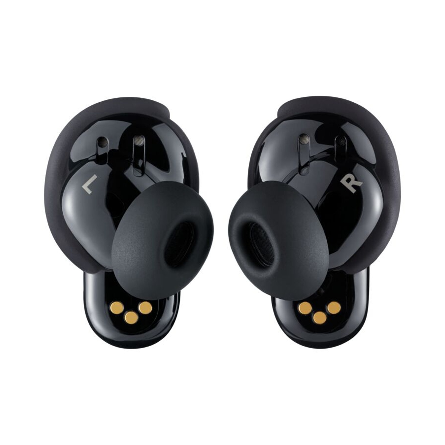 Due auricolari wireless neri, ciascuno con un puntale in gomma. Uno contrassegnato con 'L', l'altro con 'R'. Entrambi hanno punti di ricarica dorati.