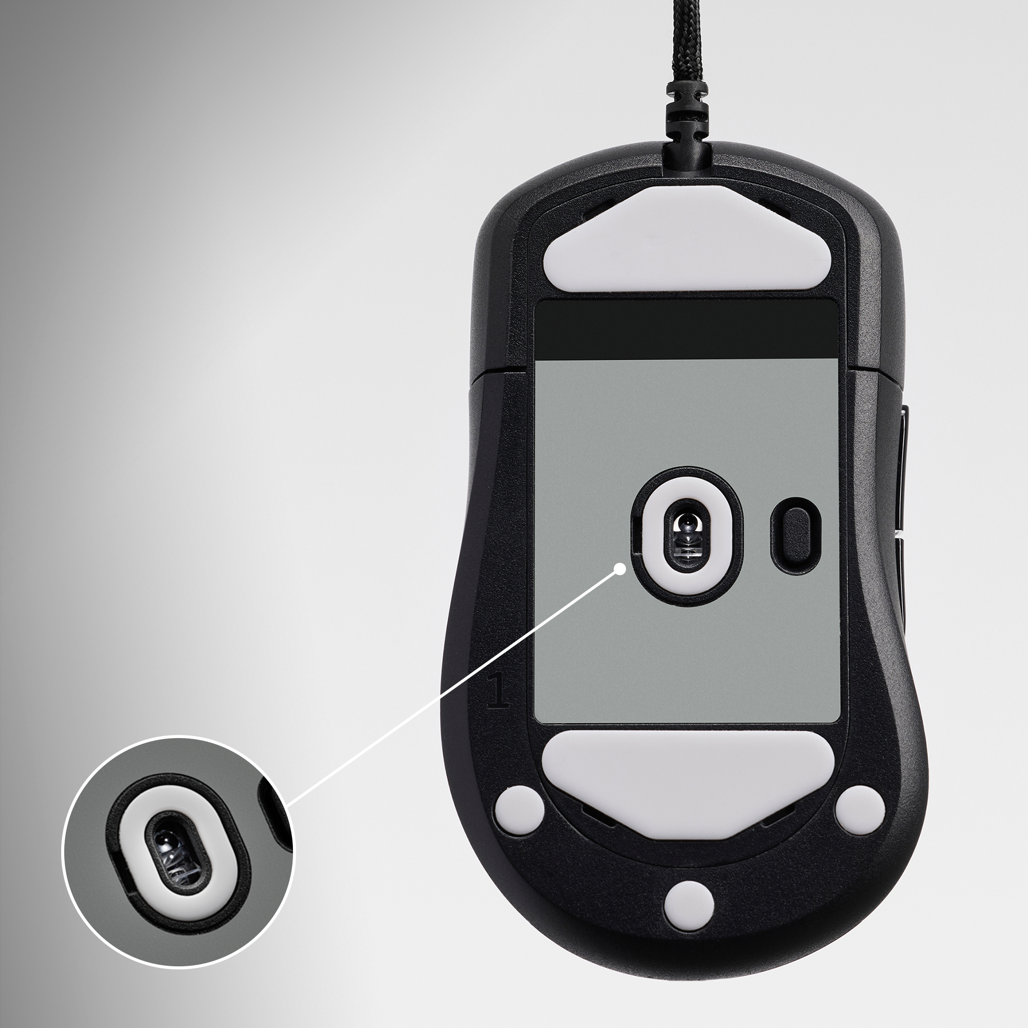 Black computer mouse bottom with white pads and an optical sensor. A zoomed view shows the sensor in detail.