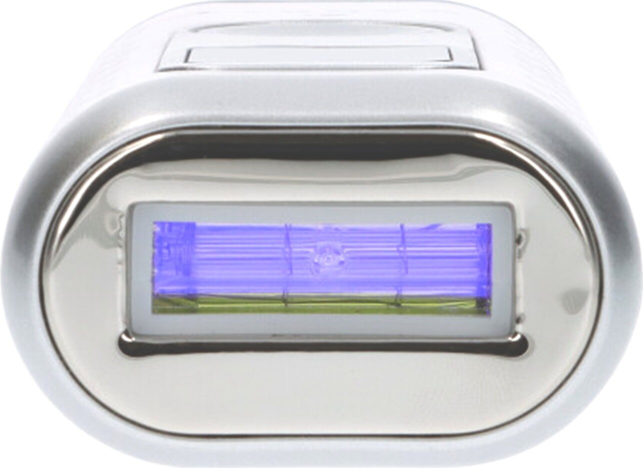 Srebrne urządzenie do usuwania włosów z niebieskim światłem emitowanym ze środka. Ma metalową, owalną głowicę.