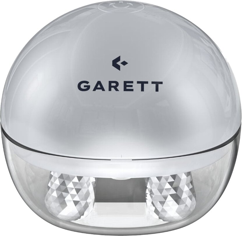 Przezroczyste, kuliste urządzenie z napisem "GARETT". Dolna część zawiera dwa kryształopodobne obiekty.