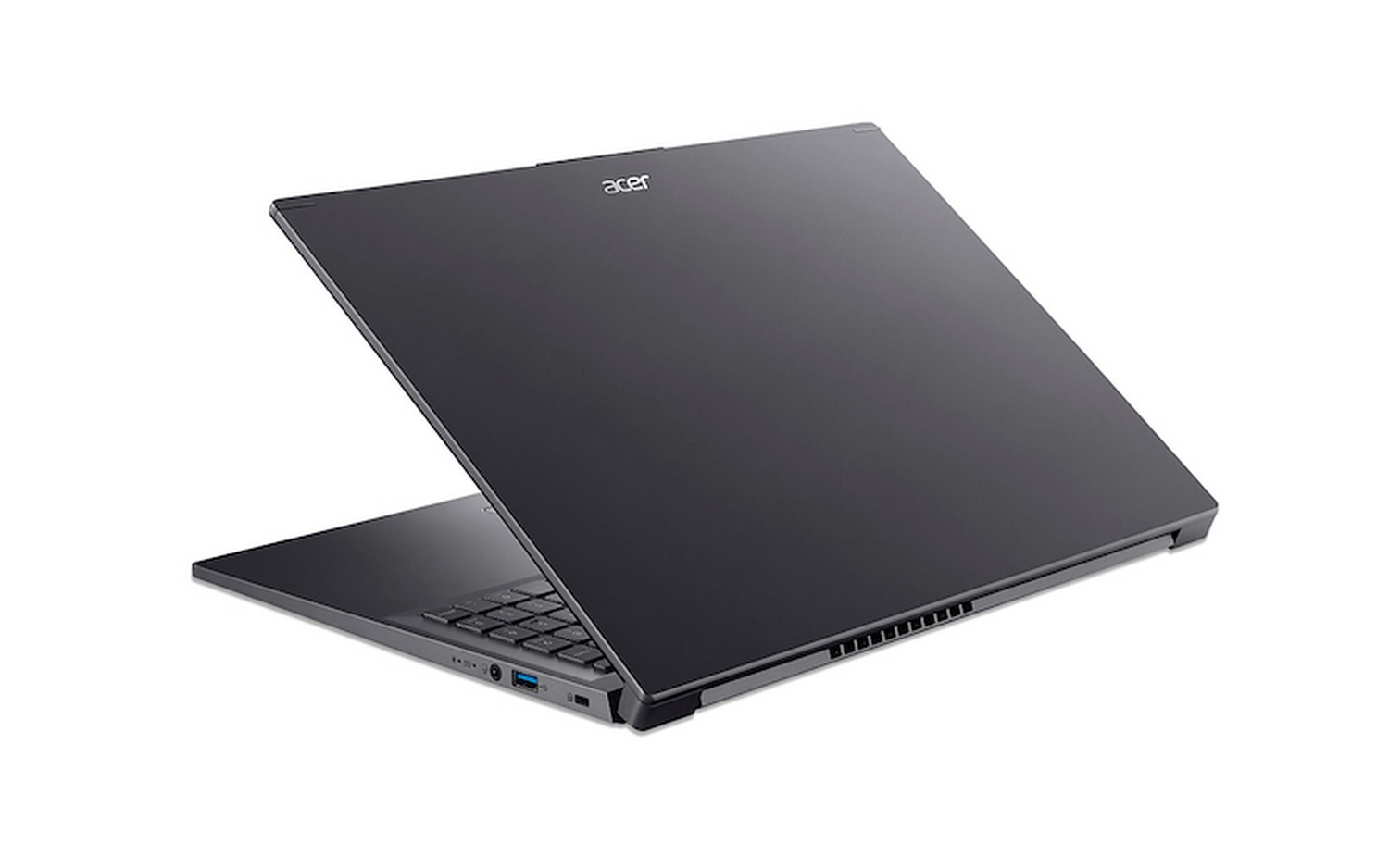 Portátil Acer gris oscuro, parcialmente abierto. La pantalla está levantada, revelando el teclado. Fondo blanco.