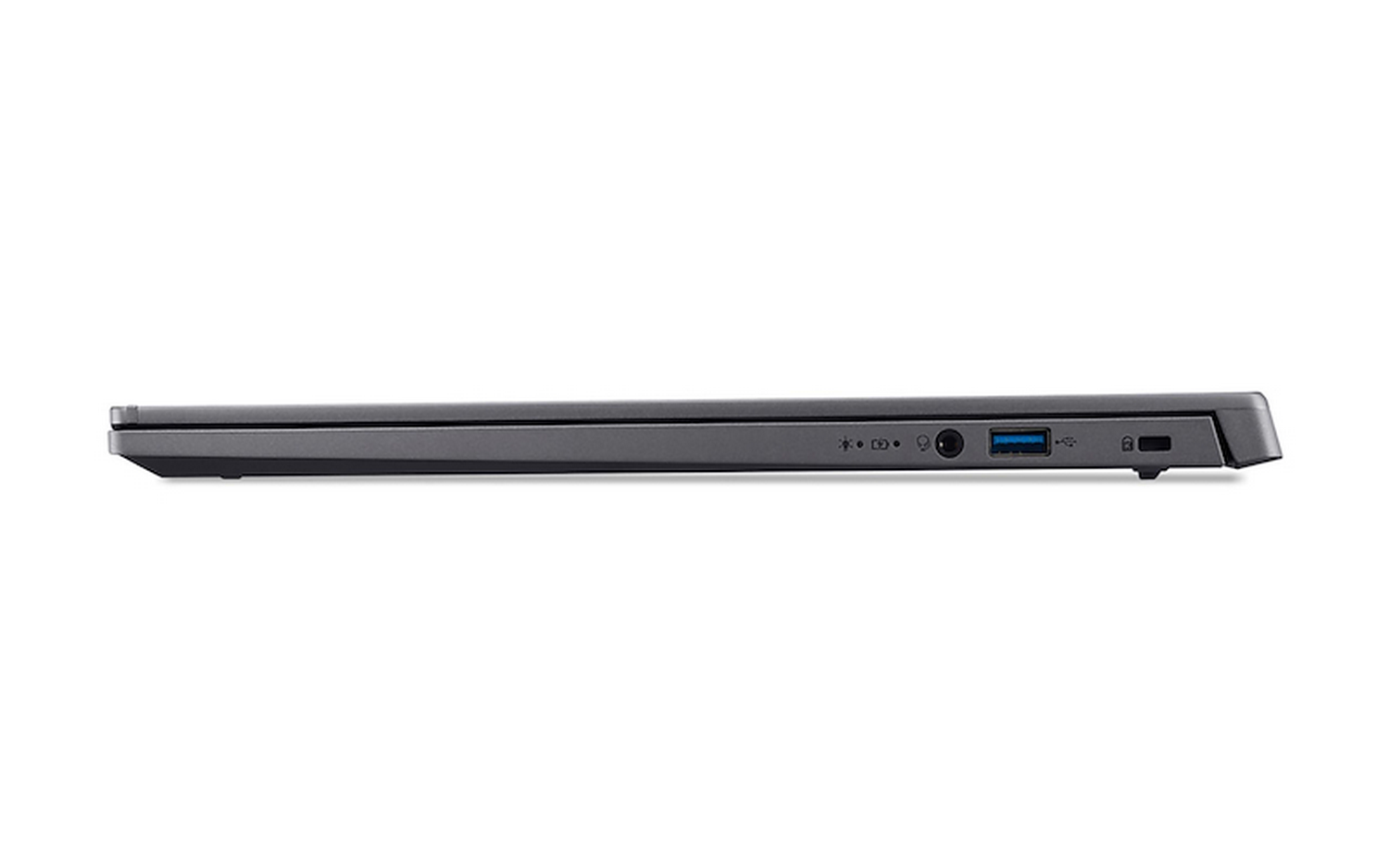 Vista lateral de un portátil gris oscuro. Los puertos visibles incluyen USB, alimentación y un candado. El fondo es blanco.