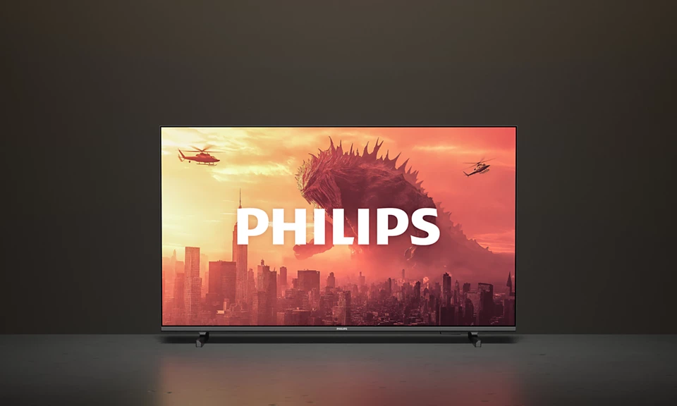 A Philips TV egy szörny által megtámadott várost mutat, helikopterek repülnek. A Philips logó fehér.