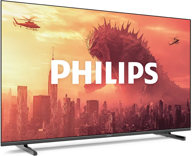 Egy Philips TV városi jelenetet mutat helikopterekkel, szörnnyel és a Philips logóval. A háttér vörös-narancs.