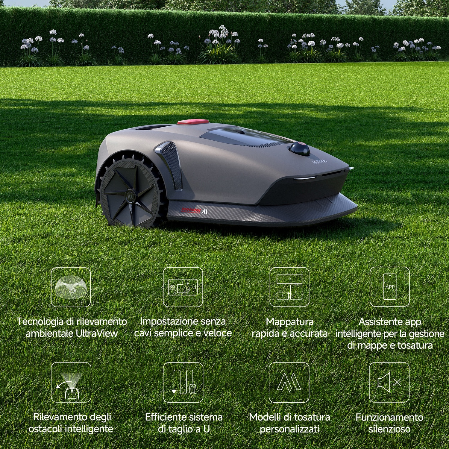 Un robot tosaerba su erba verde. Sullo sfondo, una siepe e dei fiori. Il tosaerba è grigio e nero.