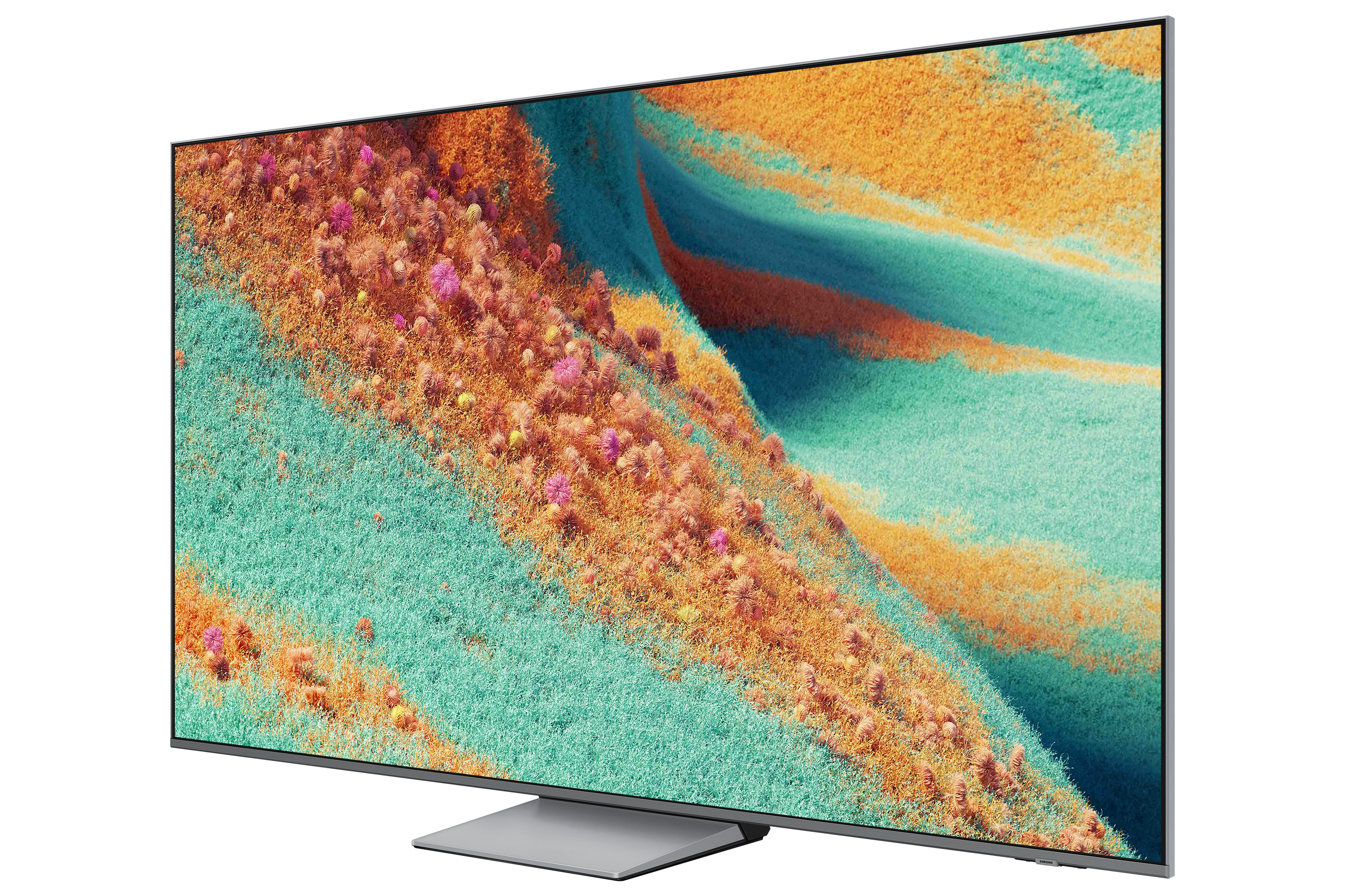 Ein Fernseher zeigt eine lebendige, abstrakte Landschaft mit grünen, orangefarbenen und rosa Texturen auf schwarzem Grund.
