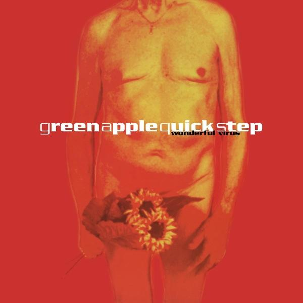 Nackter Mann mit Blumen, roter Hintergrund. Text 'greenapplequickstep wonderful virus'.