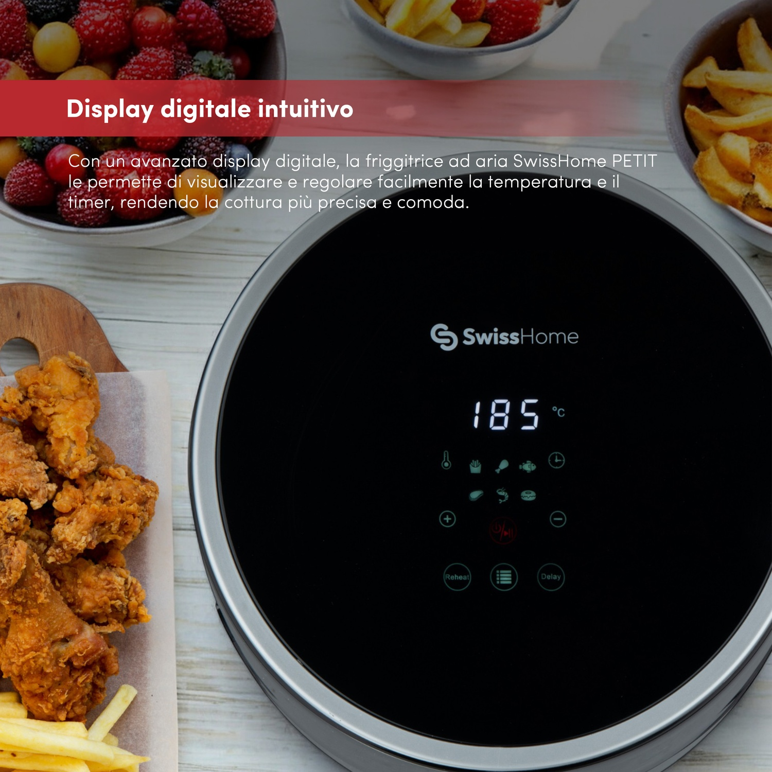 Friggitrice ad aria con display digitale che mostra 185 gradi. Cibi fritti e bacche in ciotole circondano la friggitrice.