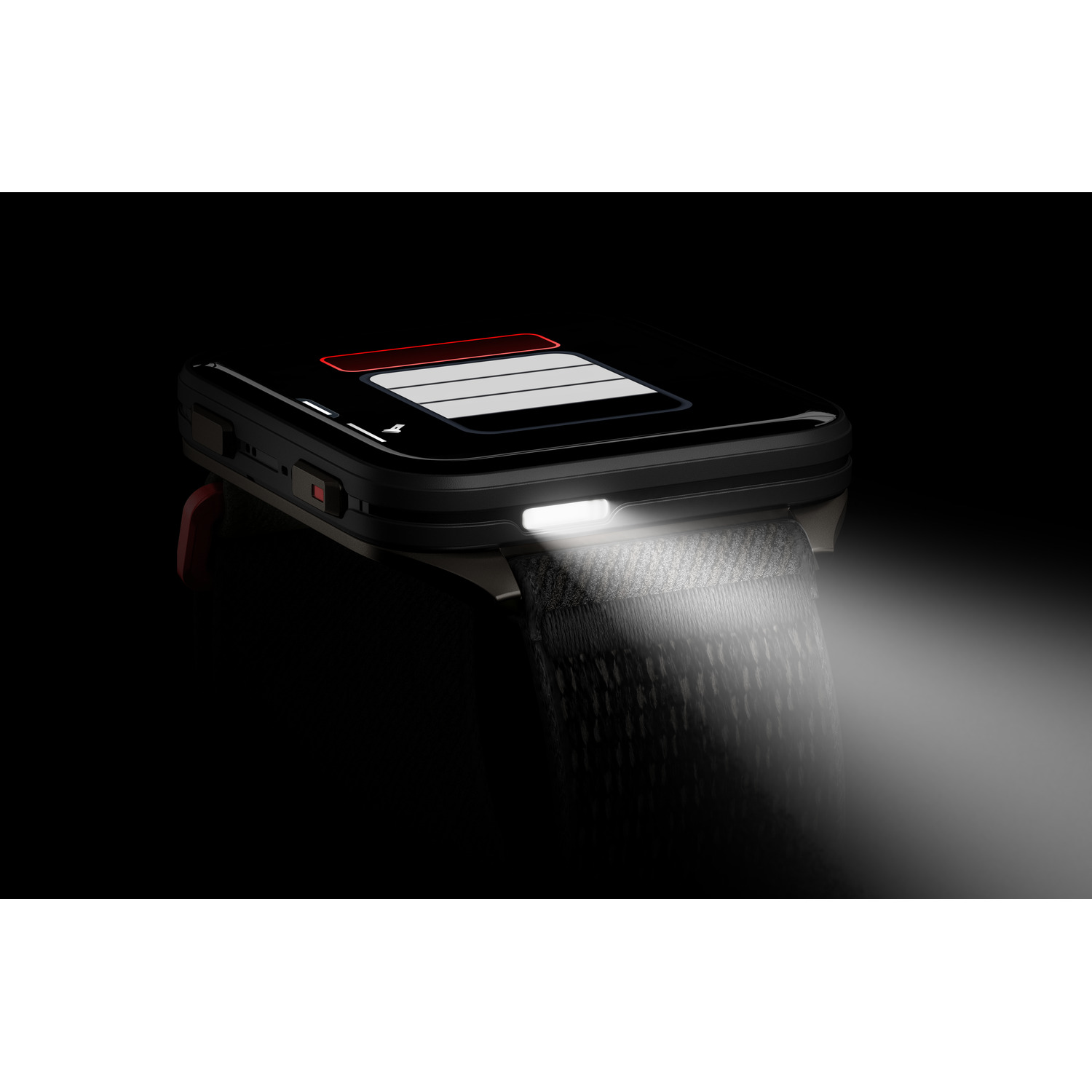 Montre connectée noire avec une lumière vive éclairant une surface grise. La montre a un bracelet rouge et est sur fond noir.