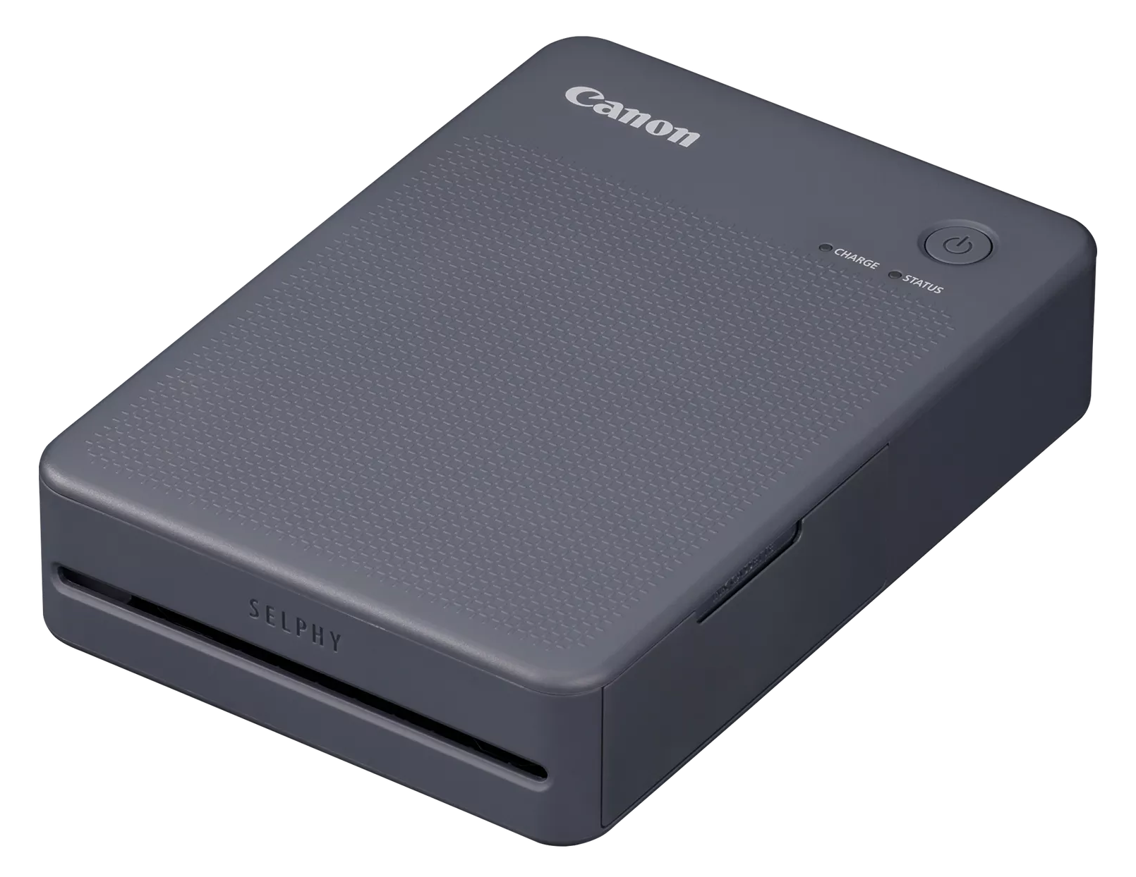 Drukarka fotograficzna Canon Selphy, szara. Posiada przycisk zasilania, wskaźniki ładowania/statusu. Widoczne logo Selphy.