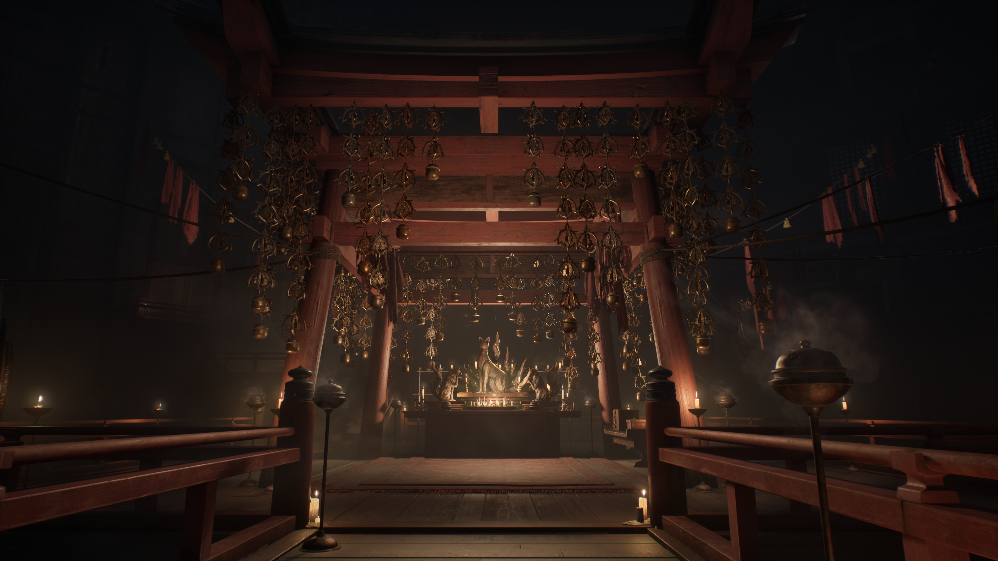 Ozdobne, czerwone, drewniane japońskie sanktuarium. Złote dzwony wiszą. Świece oświetlają wnętrze, odsłaniając posągi.