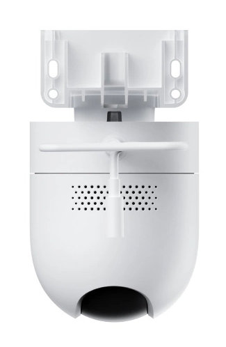 Biała kamera bezpieczeństwa, zamontowana na białym wsporniku. Kamera ma zaokrągloną podstawę z ciemnym otworem. Obecna jest mała antena.