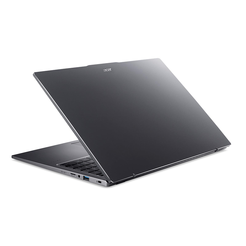 Una computadora portátil Acer gris está abierta, ligeramente inclinada. El teclado es visible, con fondo blanco. El logo de Acer es visible.