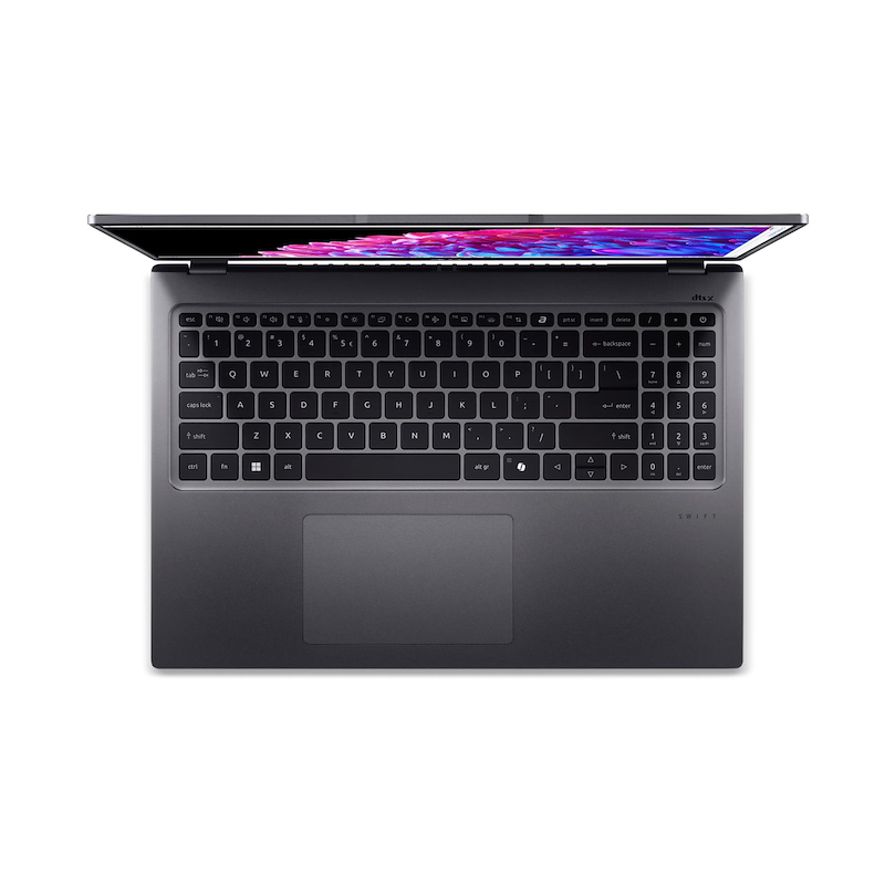 Vista superior de un portátil gris con pantalla abierta que muestra gráficos coloridos, teclado visible. Fondo blanco.