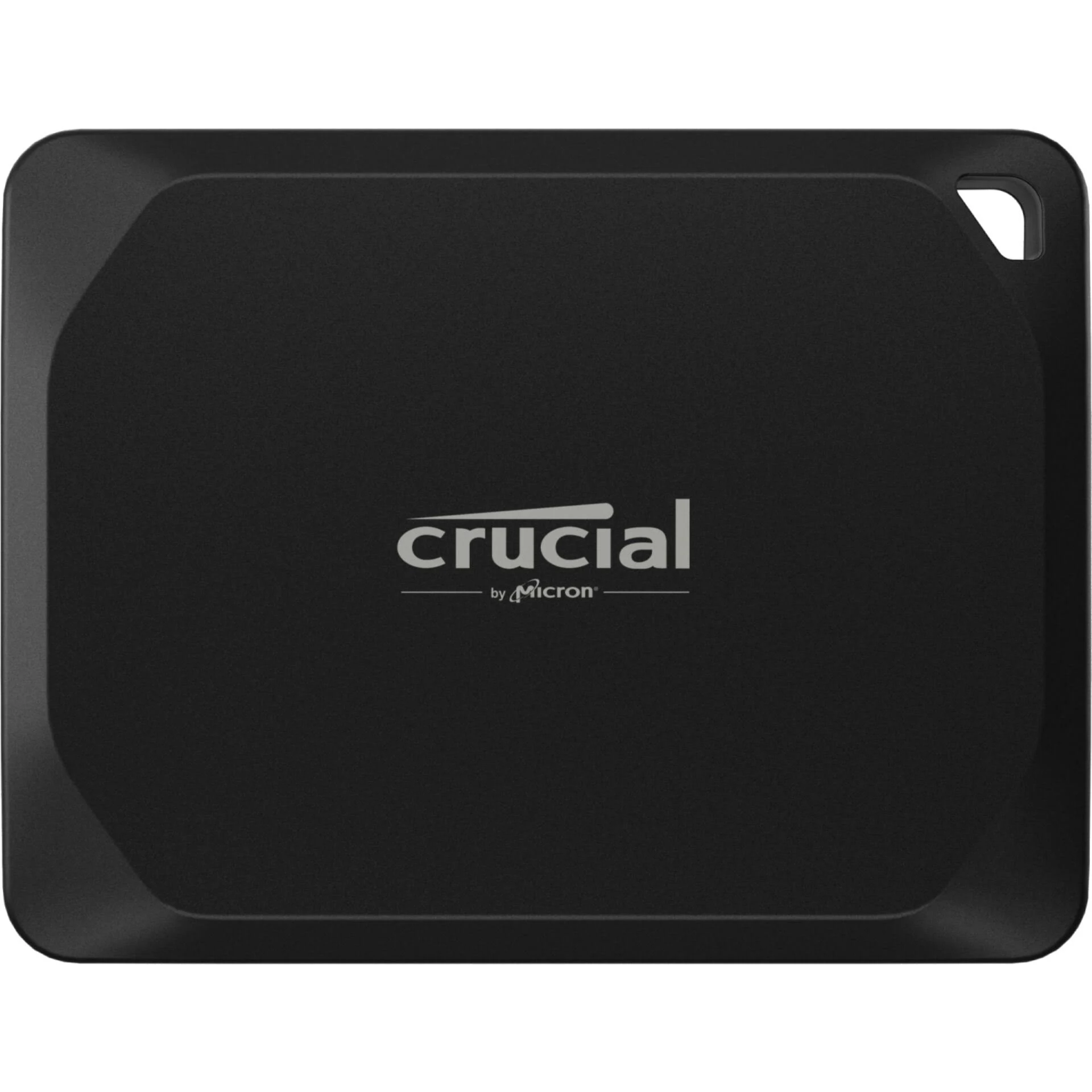 SSD externa Crucial negra. Rectangular con esquinas redondeadas. Logotipo Crucial centrado. Un agujero arriba a la derecha.