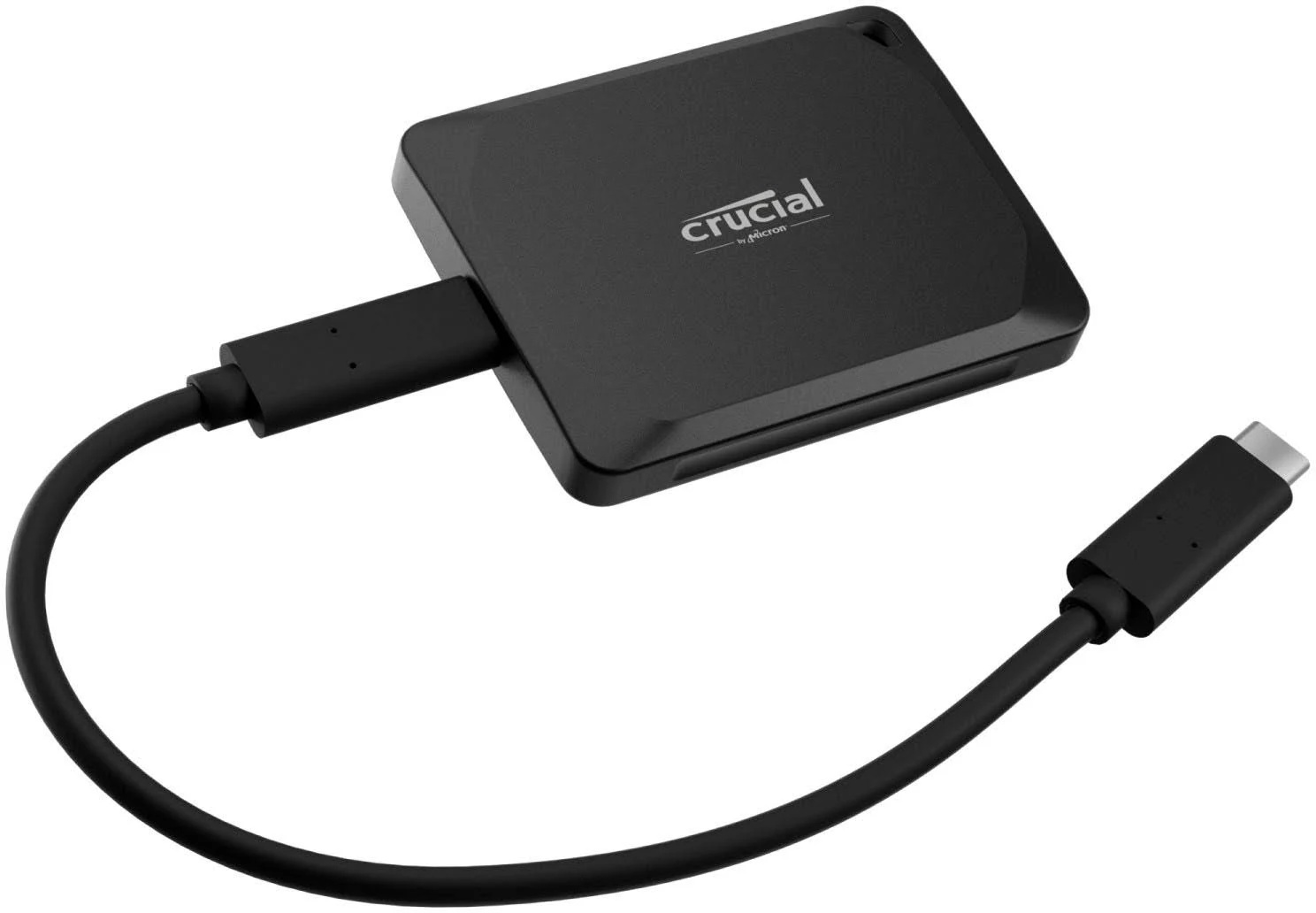 SSD externa Crucial negra. Tiene un cable USB-C.