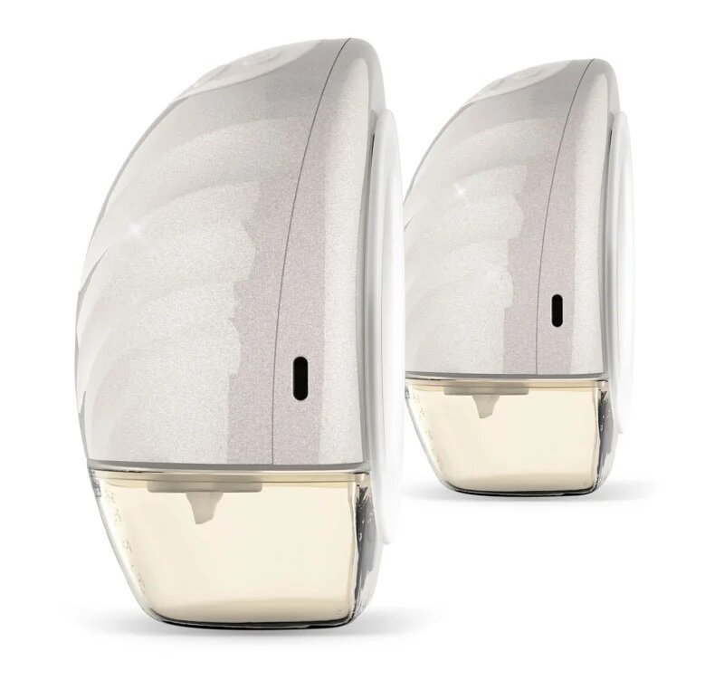 Dwie laktatory. Każdy ma białą obudowę, przezroczysty pojemnik i czarny przycisk. Pojemniki są wypełnione cieczą.