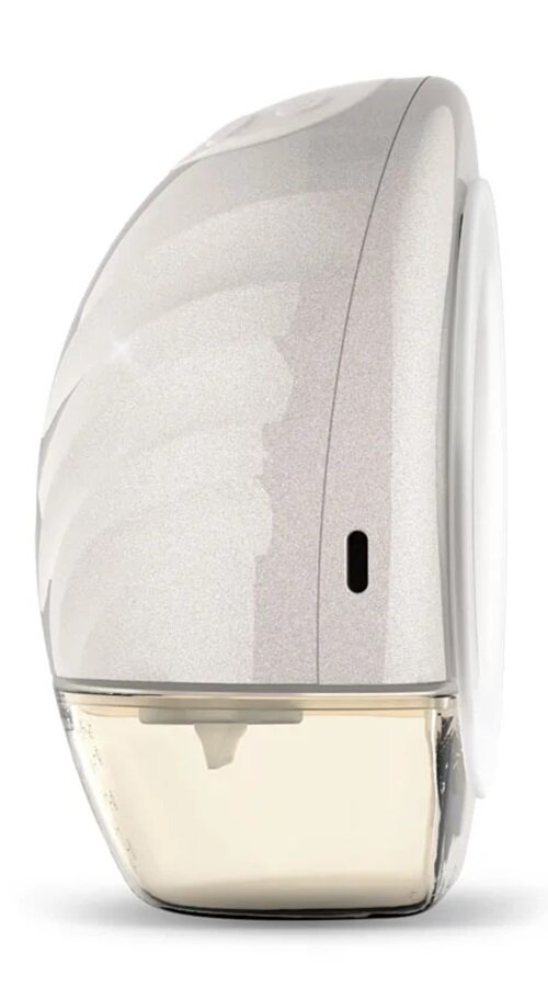 Laktator, biały i srebrny, z przezroczystym, zakrzywionym pojemnikiem zawierającym jasnożółtą ciecz.