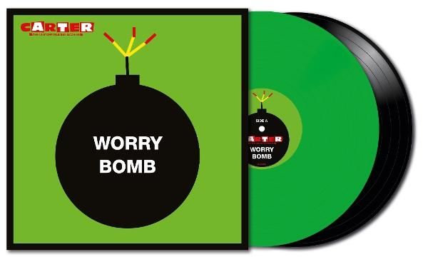 Vinylplatte mit grüner Scheibe und schwarzem Rand. Das Cover hat eine schwarze Bombengrafik mit dem Text 'Worry Bomb' und einem grünen Hintergrund.