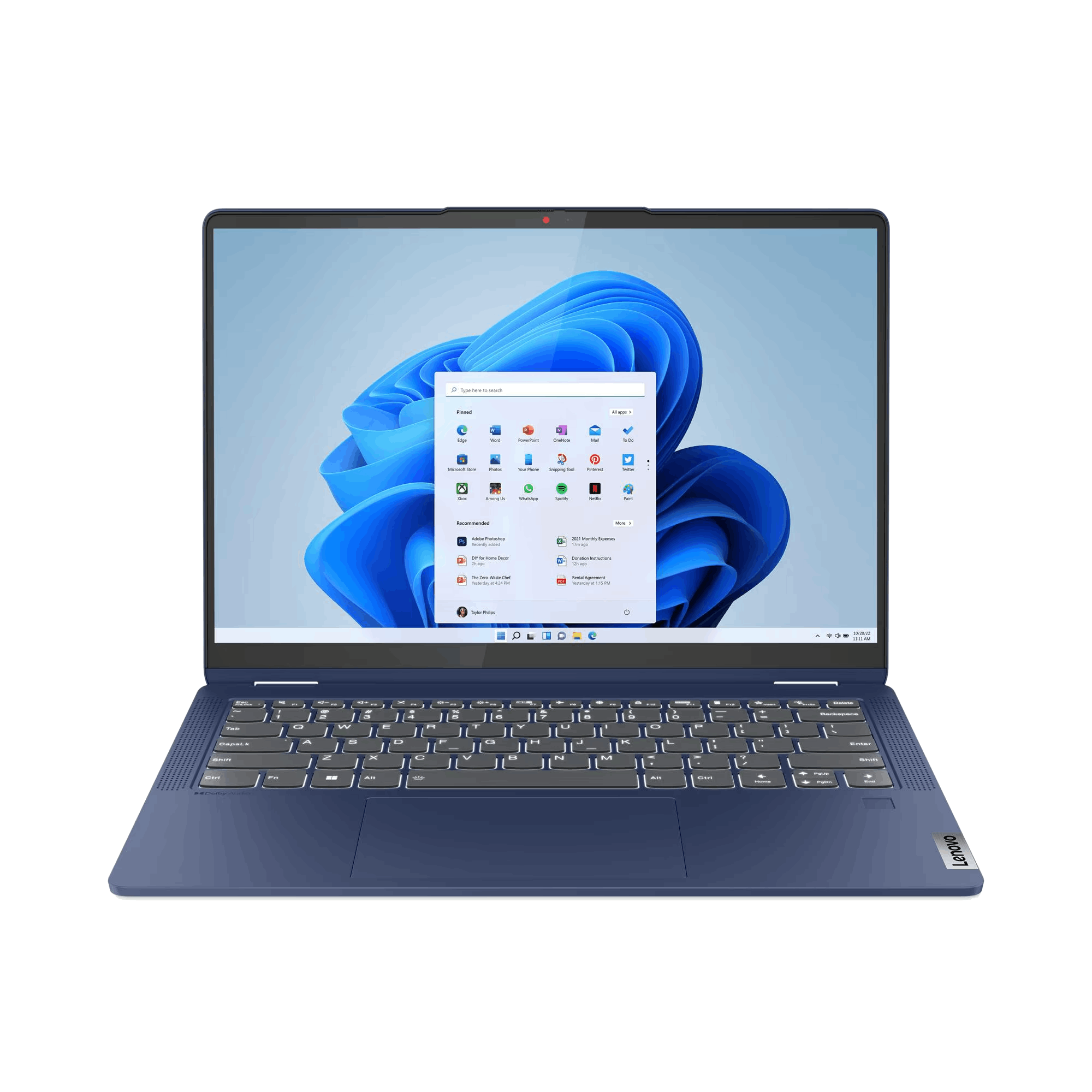 Un portátil Lenovo azul está abierto, mostrando el escritorio de Windows 11. La pantalla muestra iconos de aplicaciones sobre fondo azul.