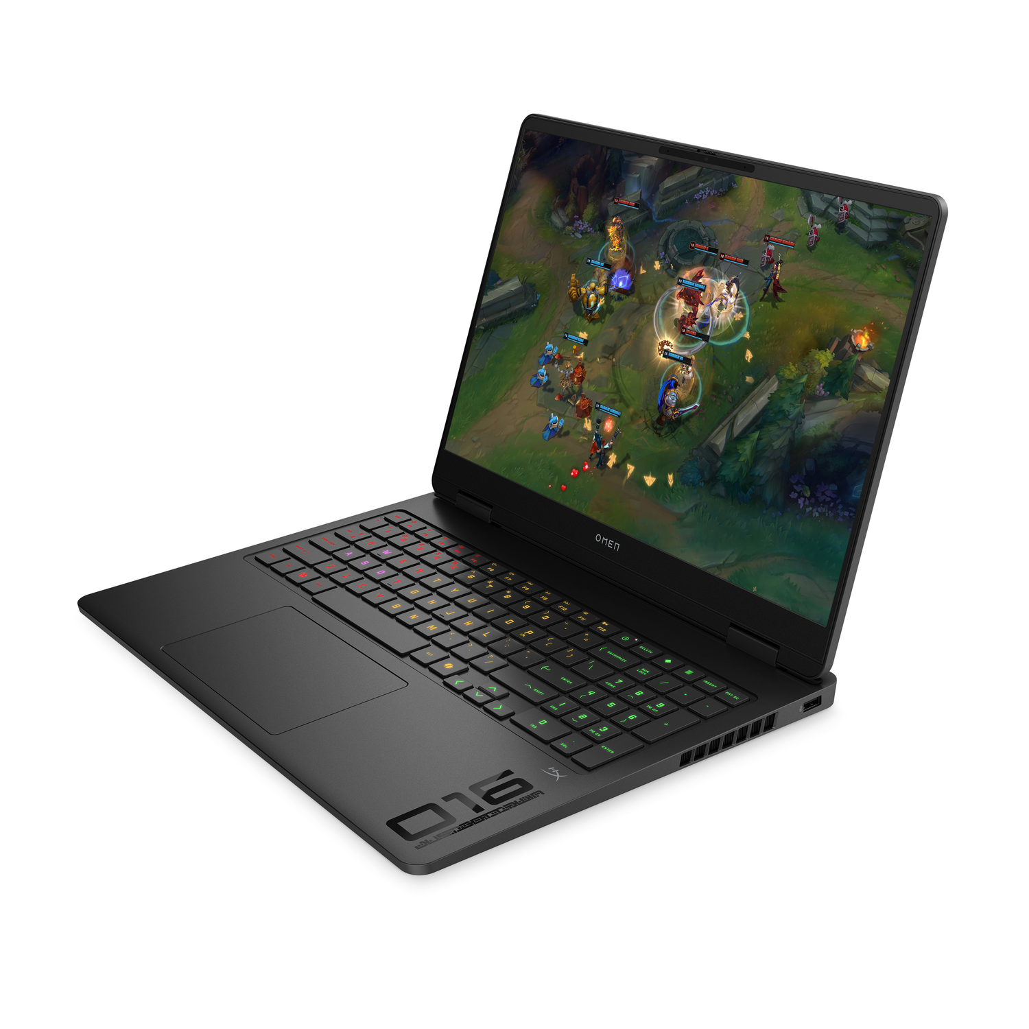 Black Omen 16 gaming laptop. The screen displays a video game. The keyboard has multi-colored keys. The laptop is on a white surface.