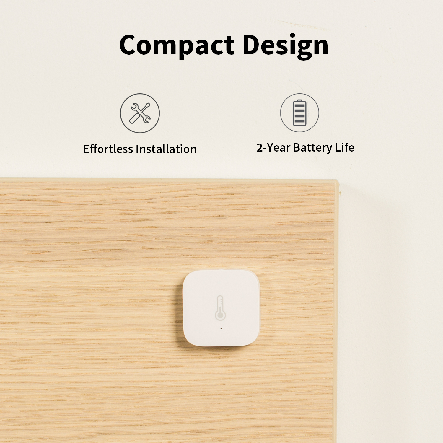 A white square sensor with a thermometer icon is on wood. Text above says 'Compact Design'. Icons and text about installation and battery life.