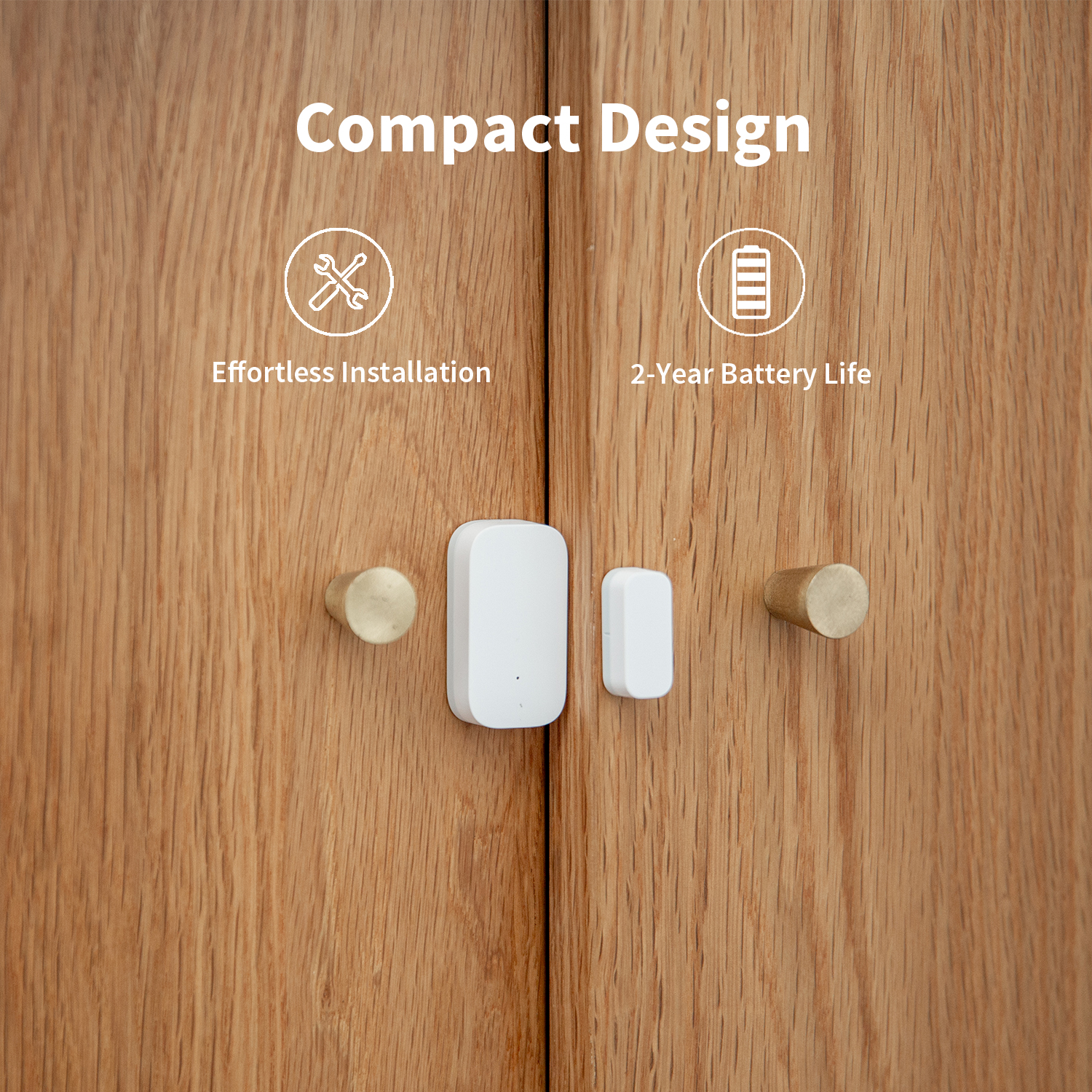 A white sensor and a small white component are on a wooden cabinet door. It has brass knobs and the text 'Compact Design'.