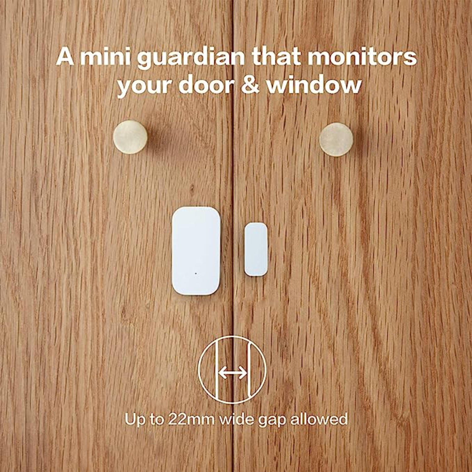 Wooden door with two brass knobs. White sensors are attached. Text says 'mini guardian' and 'Up to 22mm wide gap allowed'.