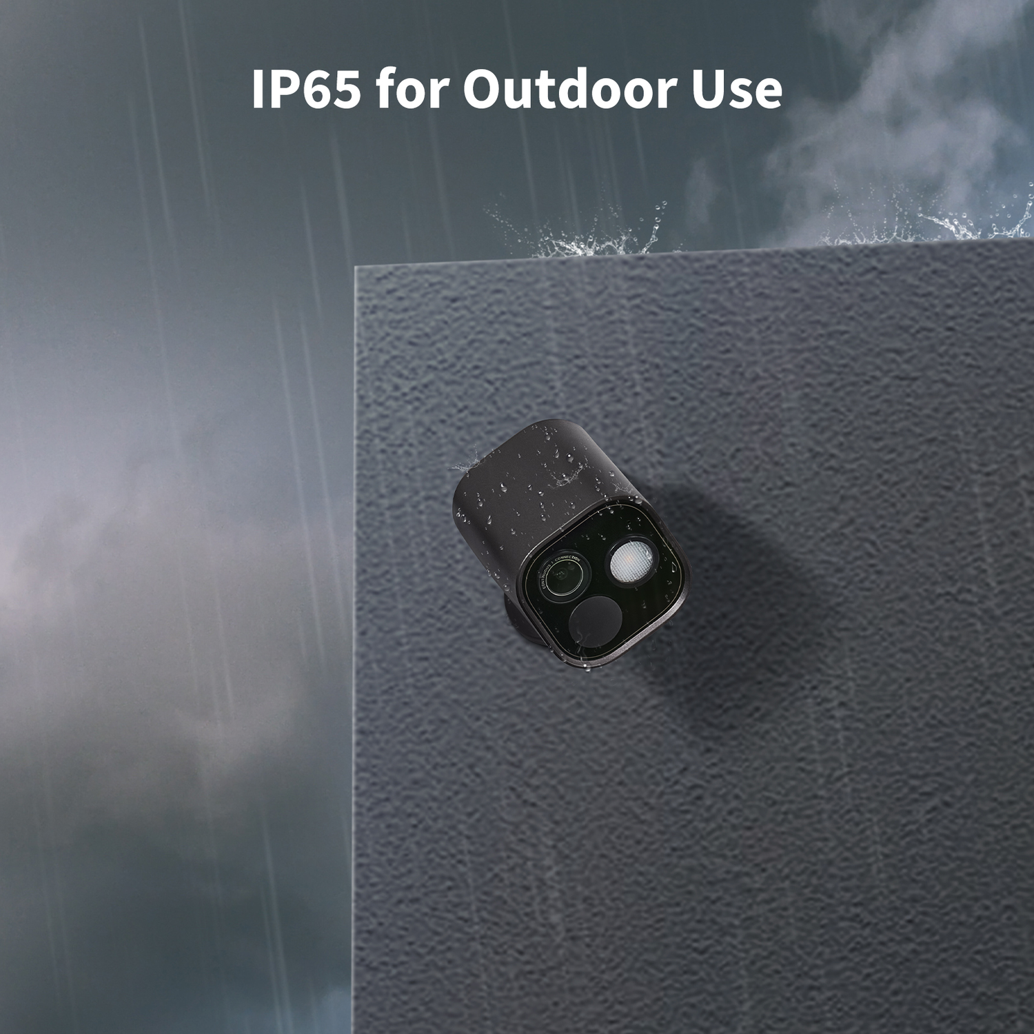 A black security camera is mounted on a gray wall. Raindrops are visible on the camera and the wall, with the text 'IP65 for Outdoor Use'.