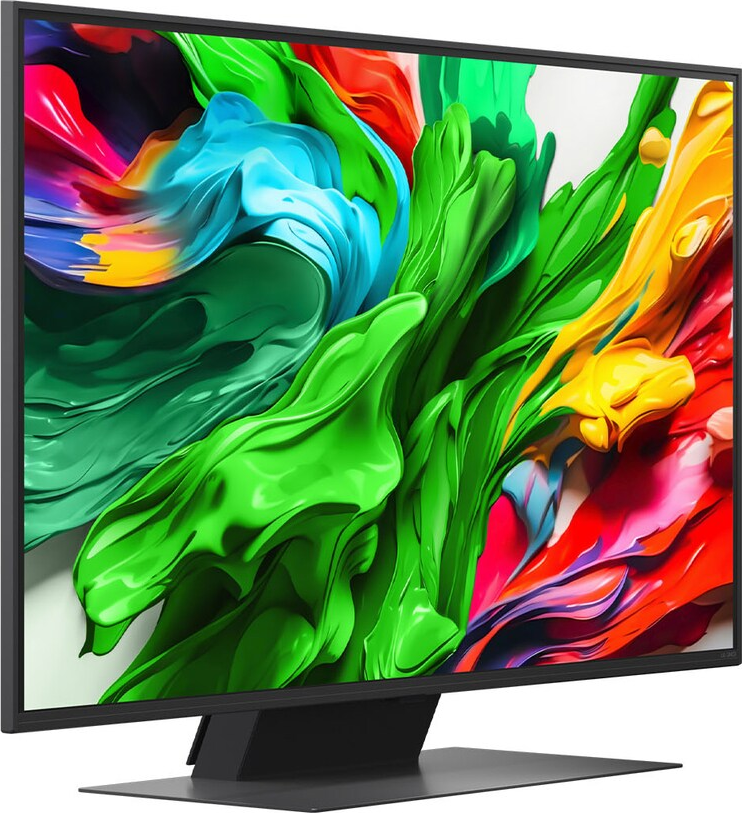 Un ampio monitor mostra arte astratta colorata. I colori includono verde, blu, giallo e rosso. Il supporto è nero.